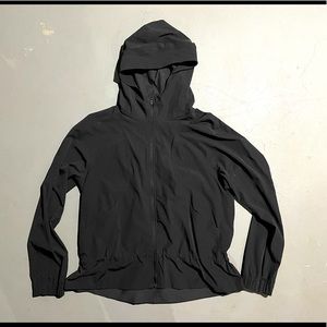 Lululemon windbreaker with water repellency. Cinch at back waist. Sits at hip.